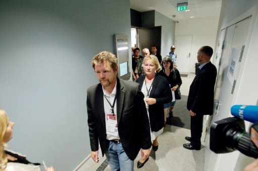 Trond Henry Blattmann (left) and Christin Bjelland, representing a group of survivors and relatives of victims of the 22 July attacks, leave the courtroom in protest before the final statement from mass killer Anders Behring Breivik in court at his trial in Oslo on Friday