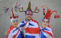 (From the left) Juliet Cooke, Chris Wilkinson and Josie Todd model hair sculptures by the Catalonian performance artist Osadia, who has recreated London landmarks to celebrate the 2012 Olympics.. Picture date: Thursday August 9, 2012. Photo credit should read: Stefan Rousseau/PA Wire