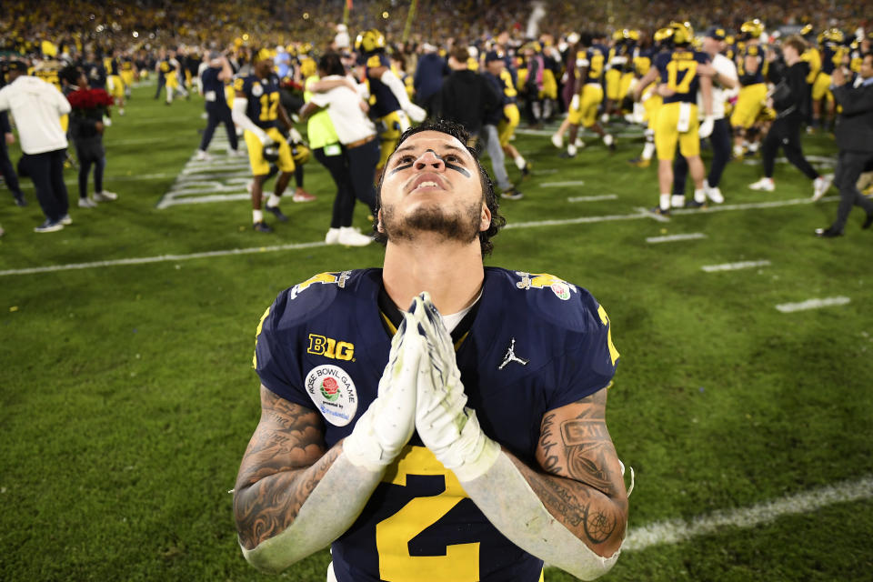 Michigan running back Blake Corum (2) gestures after an overtime win over Alabama at the Rose Bowl CFP NCAA semifinal college football game Monday, Jan. 1, 2024, in Pasadena, Calif. (AP Photo/Kyusung Gong)