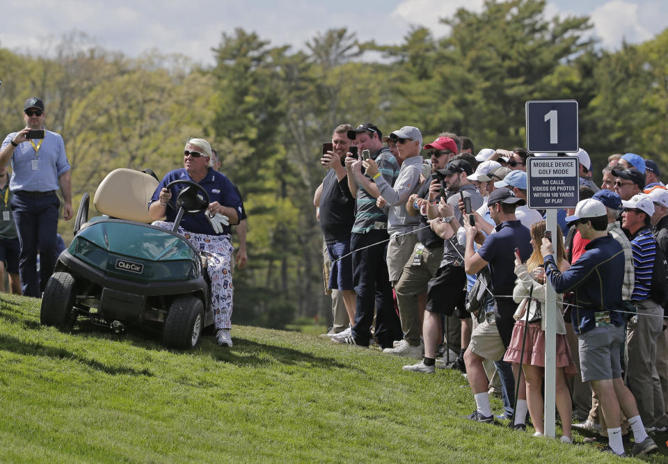 John Daly drives up to the first tee in a golf cart during the first round of the PGA Championship golf tournament, Thursday, May 16, 2019, at Bethpage Black in Farmingdale, N.Y. (AP Photo/Seth Wenig)