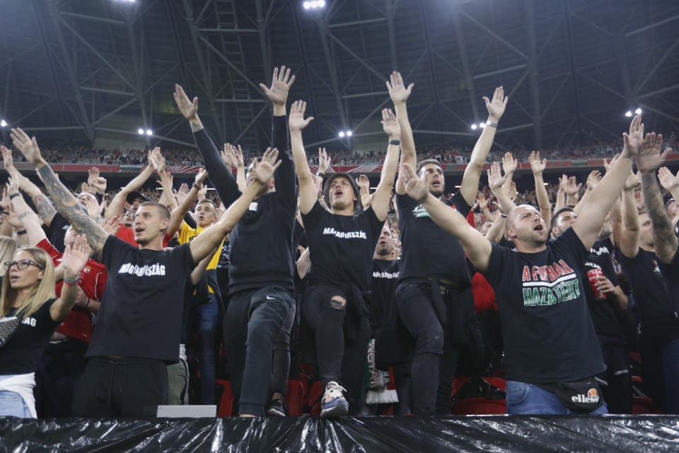 FILE - Hungarian fans cheer ahead of the World Cup 2022 group I qualifying soccer match between Hungary and England at the Ferenc Puskas stadium in Budapest, Hungary, Thursday, Sept. 2, 2021. The unpredictability of the European Championship, which kicks off in Munich on Friday, is what makes it such compelling viewing. Even in its expanded format of 24 teams, there is always the potential for a surprise. (AP Photo/Laszlo Balogh, File)