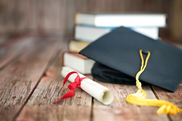 <p>Getty Images</p> A stock image of a graduation cap and a diploma.