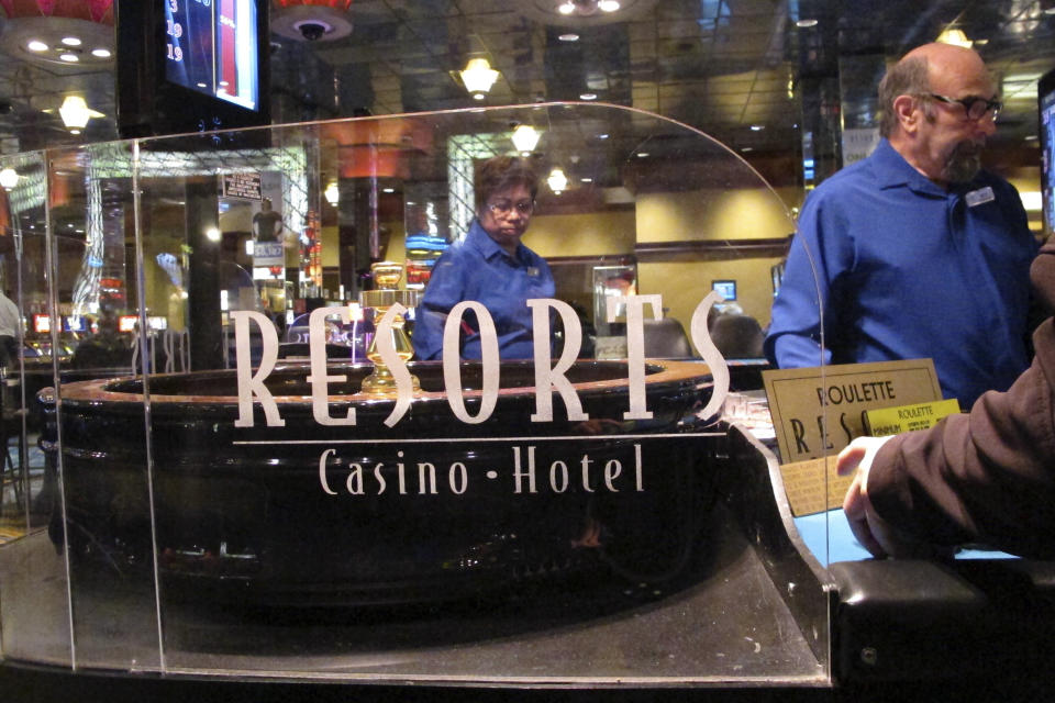 Dealers conduct a game of roulette at Resorts Casino in Atlantic City, N.J. on April 20, 2018. The Mohegan tribe will end its management of Atlantic City's Resorts casino at the end of this year, both parties said Monday, Feb. 26, 2024. (AP Photo/Wayne Parry)