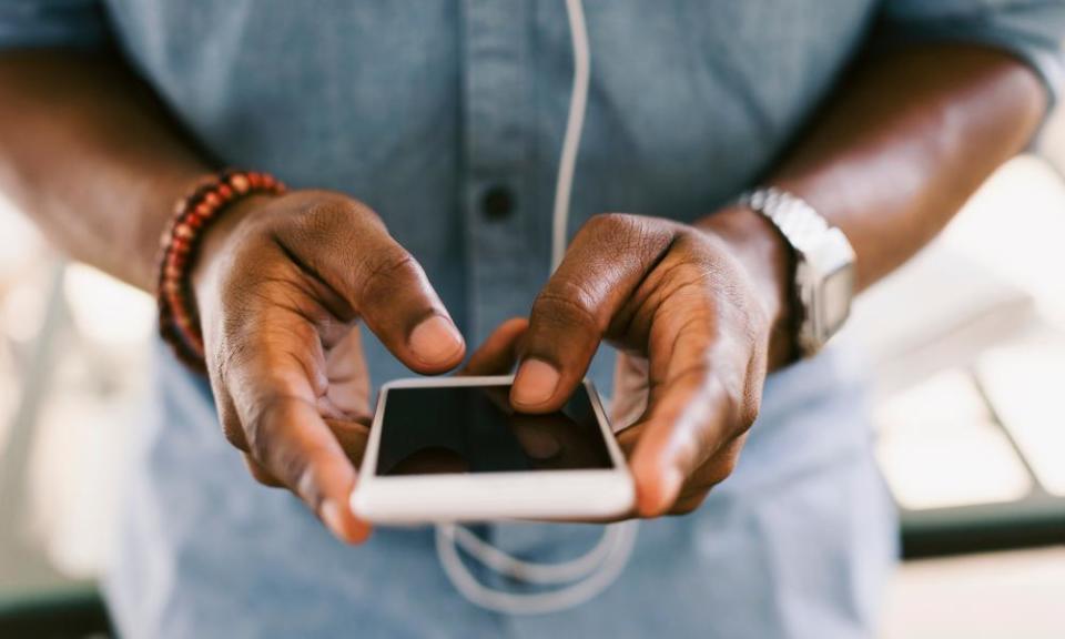 A man holding a smartphone.