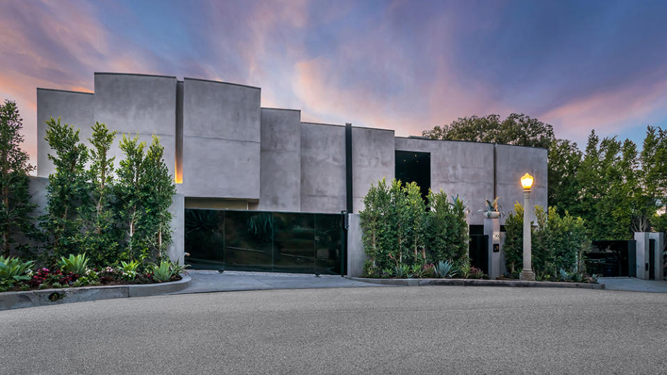 The home features a brutalist facade and black security gates. - Credit: Oppenheim Group