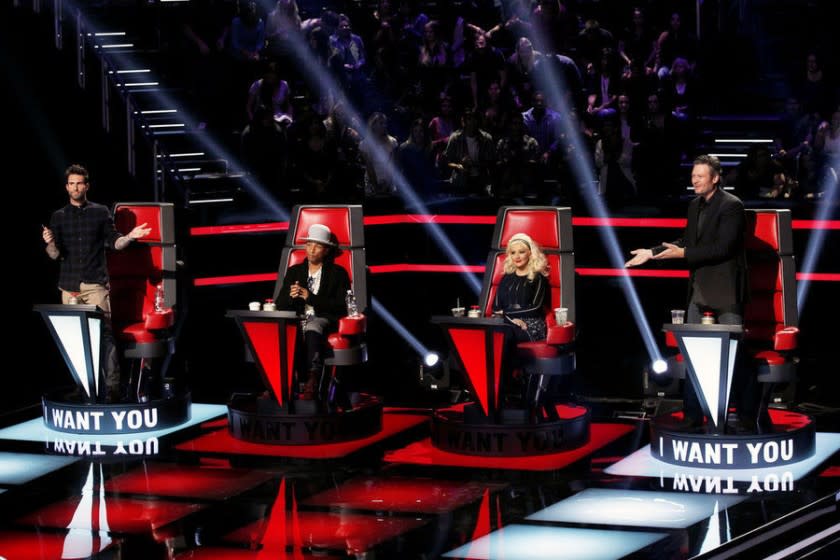 Adam Levine, Pharrell Williams, Christina Aguilera and Blake Shelton compete for contestants during the Season 8 premiere of "The Voice."