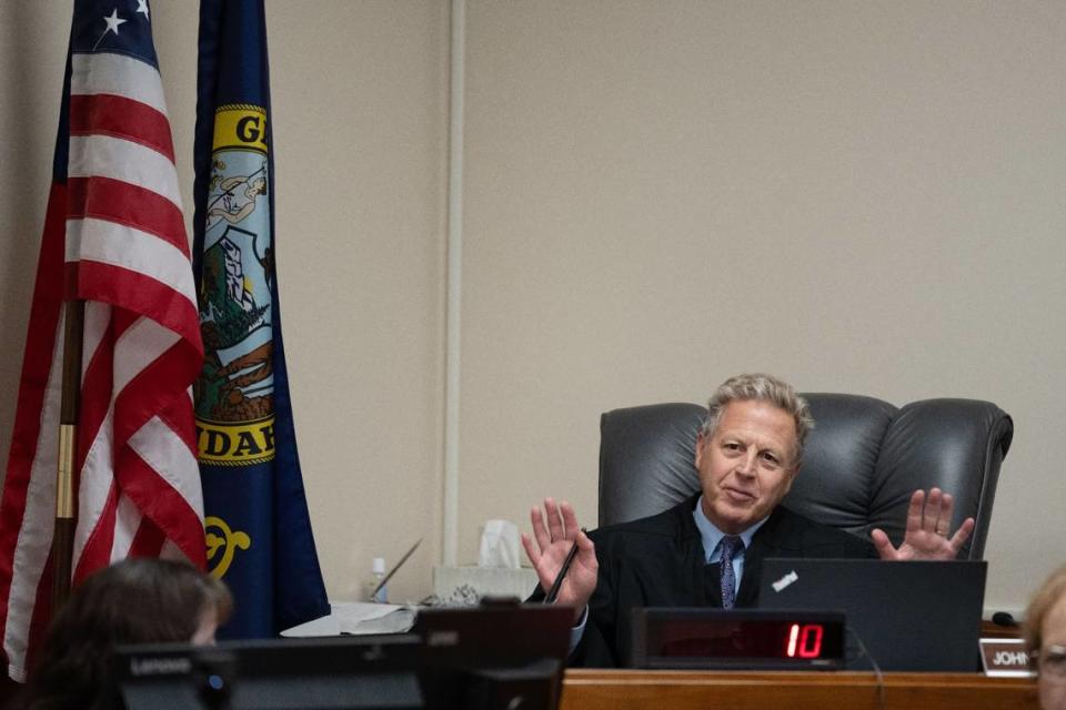 Judge John Judge of Idaho’s 2nd Judicial District oversees a pretrial hearing for Bryan Kohberger, who is charged with killing four University of Idaho students, in September 2023. Ted S. Warren/AP