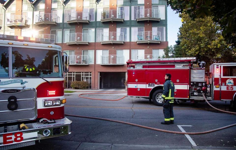 The Boise Fire Departments responds to a car on fire in the first story garage of the C.W. Moore Apartments in downtown Boise on Thursday, Oct. 6, 2022.