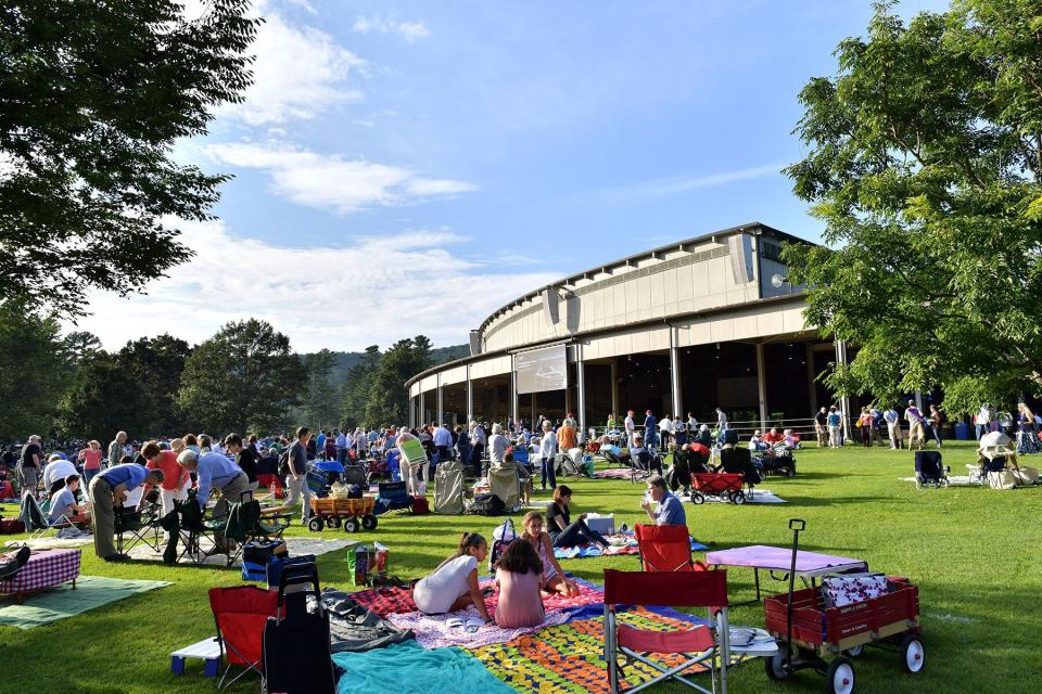 Patrons arrive early for lawn spots and set up elaborate picnic dinners at the Tanglewood Music Center