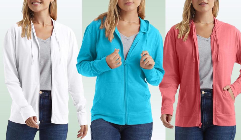 Three hooded sweatshirts in white, blue and pink.