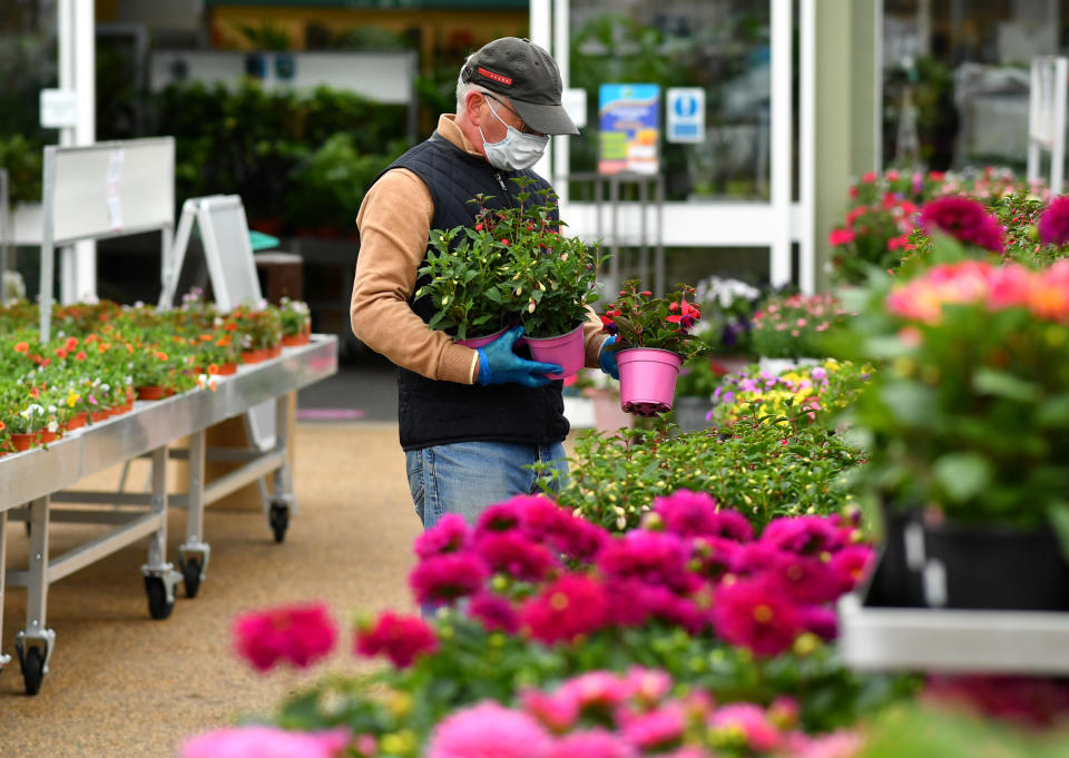 A man wearing a mask at Polhill Garden Centre, following the outbreak of the coronavirus disease (COVID-19), Sevenoaks, Britain, May 13, 2020. REUTERS/Dylan Martinez