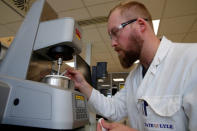 FILE PHOTO: A technician uses a rheometer to measure viscosity of cream at the Tate & Lyle European Innovation Centre in Villeneuve d'Ascq, France, September 26, 2018. REUTERS/Pascal Rossignol