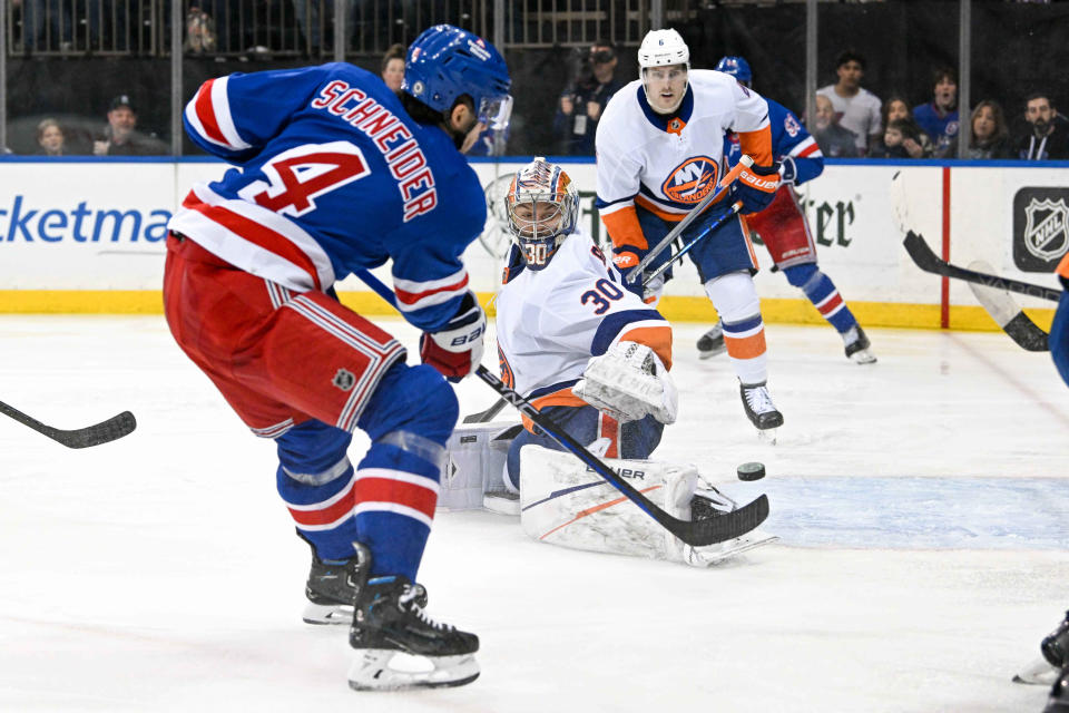 Apr 13, 2024; New York, New York, USA; New York Rangers defenseman Braden Schneider (4) shoots and scores a goal past New York Islanders goaltender Ilya Sorokin (30) during the second period at Madison Square Garden.