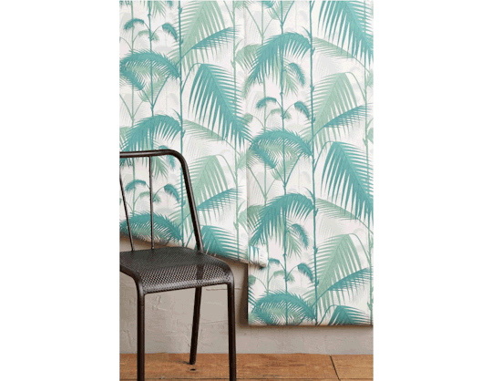 Try dressing up an accent wall with some friendly palm fronds!