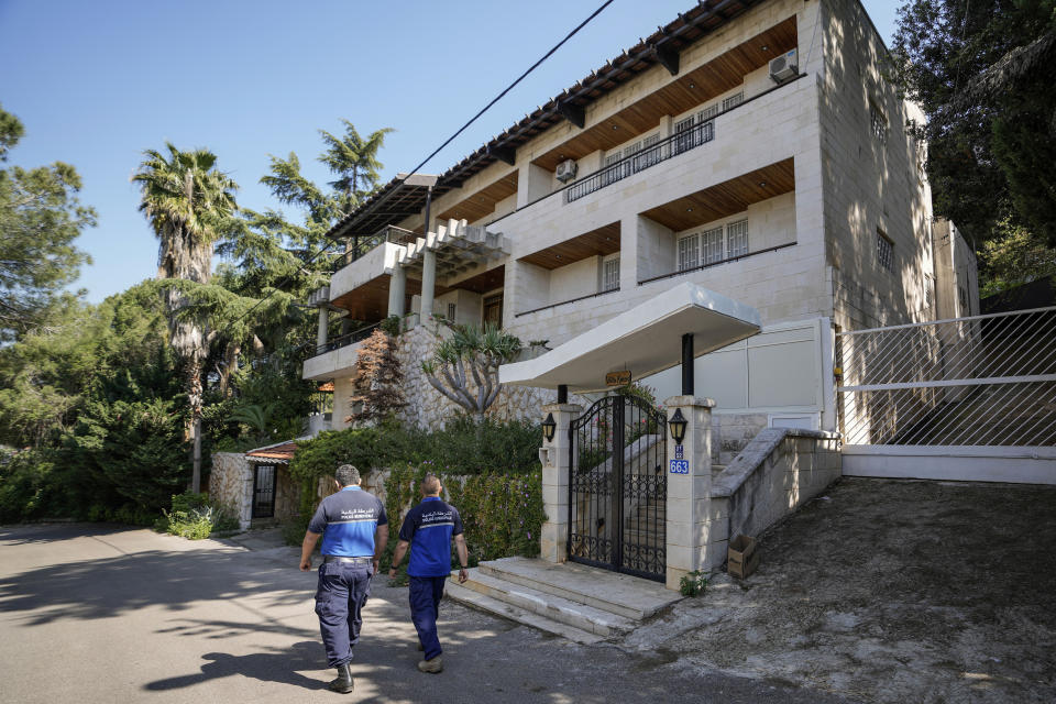 Municipal police officers patrol outside a villa where the Lebanese money changer Mohammad Srour, 57, was found tortured and killed in Monte Verdi neighbourhood of Beit Meri, Lebanon, Tuesday, April 16, 2024. Lebanon’s interior minister alleged Wednesday that the mysterious abduction and killing of a Hezbollah-linked Lebanese financier in a villa on the edge of a quiet mountain resort town earlier this month was likely the work of Israeli operatives. (AP Photo/Hassan Ammar)