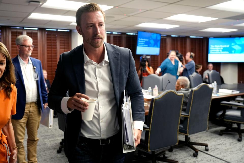 State schools Superintendent Ryan Walters leaves the meeting as the board goes into executive session during an Oklahoma State Board of Education meeting in Oklahoma City, Wednesday, July 31, 2024.
