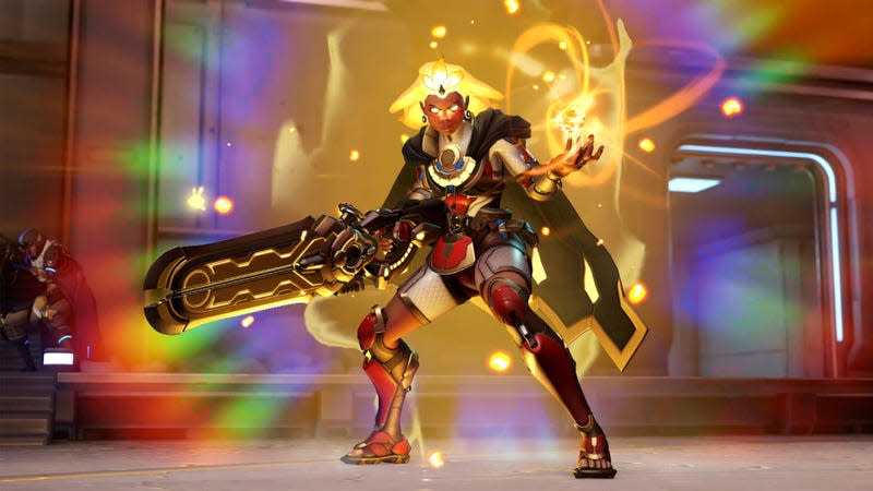 Overwatch 2 support hero Illari poses with hair eyes and hair glowing, some sort of light orb in her left hand, and her Solar Rifle in her right hand.