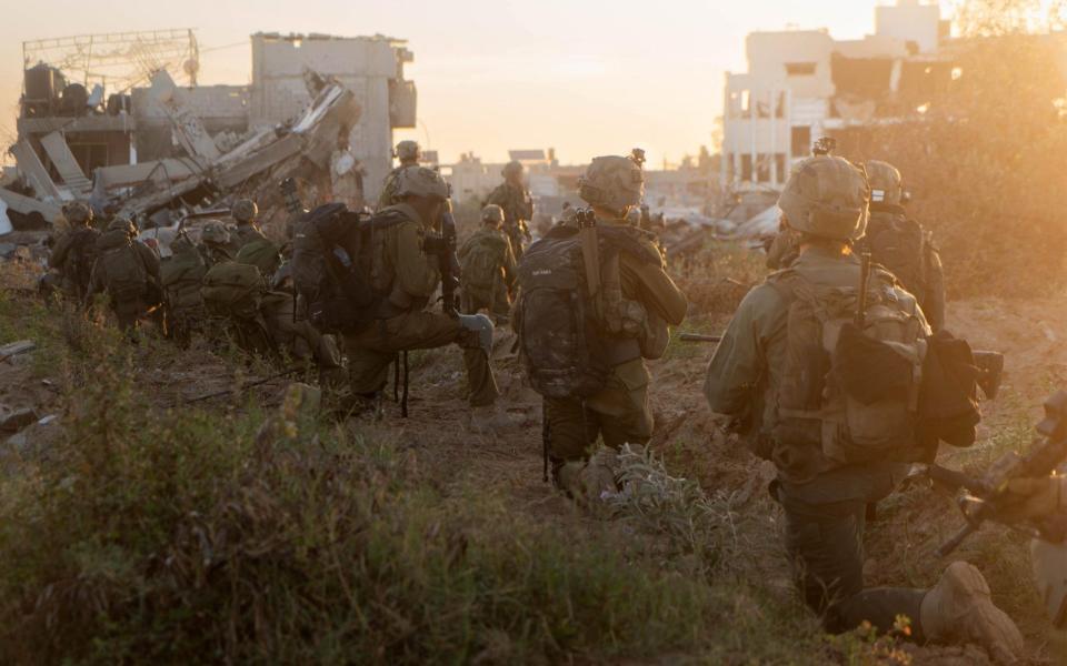 This handout picture released by the Israeli army on May 10, 2024 reportedly shows Israeli soldiers taking a position as part of the activity of the 99th Division in the Zaytoun Area of Gaza City amid the ongoing conflict in the Palestinian territory between Israel and Hamas.