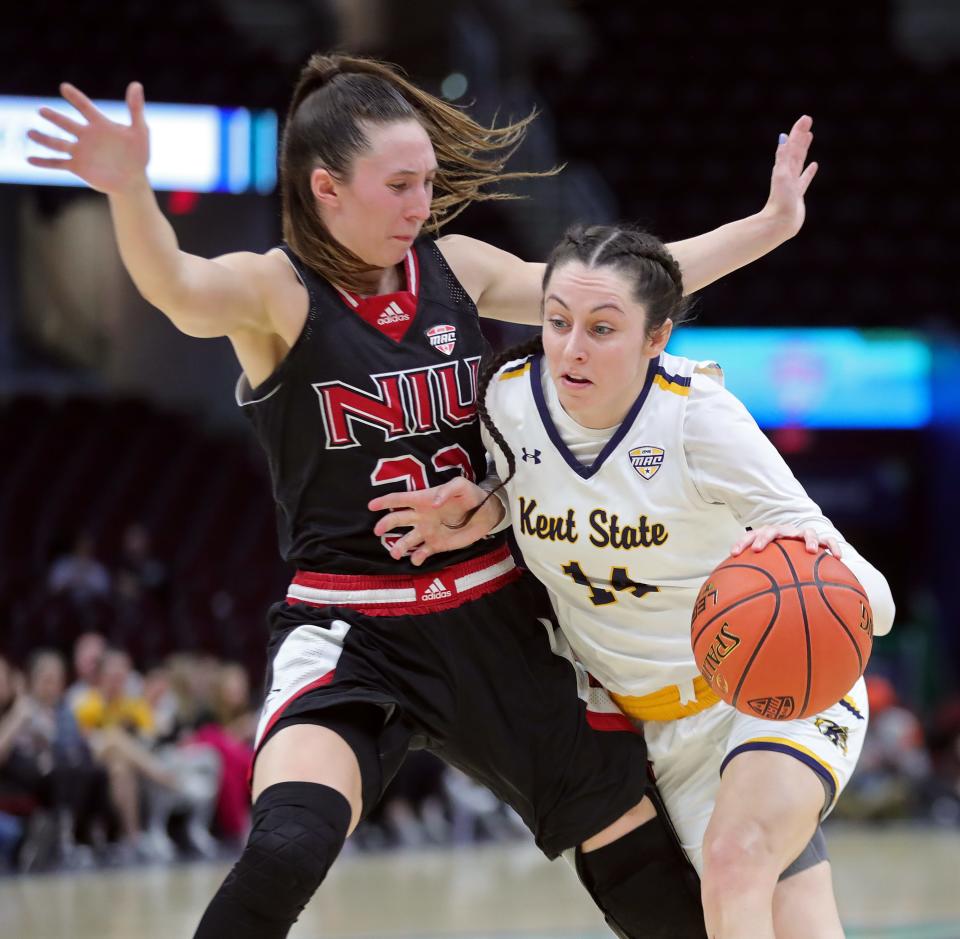 Kent State guard Katie Shumate drives around Northern Illinois guard Laura Nickel during the second half of the Mid-American Conference Tournament quarterfinals, Wednesday, March 13, 2024, in Cleveland.