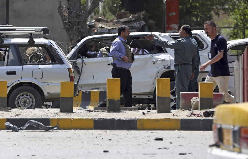 Afghan security forces inspect at the site of a car bomb explosion in Kabul, Afghanistan, Thursday, Sept. 5, 2019. A car bomb rocked the Afghan capital on Thursday and smoke rose from a part of eastern Kabul near a neighborhood housing the U.S. Embassy, the NATO Resolute Support mission and other diplomatic missions. (AP Photo/Rahmat Gul)