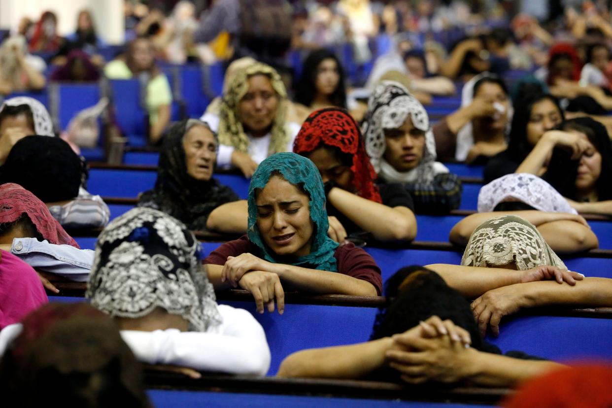 Worshipers pray for their religious leader at the International Headquarters of the Church "La Luz Del Mundo" (the Light of the World) in Guadalajara State of Jalisco, Mexico, on June 4, 2019. - The California prosecutor's office detained the leader Naason Joaquin Garcia international president of the church "La Luz Del Mondo" (Light of the World) for the alleged traffic of people, child pornography and other crimes. (Photo by Ulises Ruiz / AFP)        (Photo credit should read ULISES RUIZ/AFP/Getty Images)