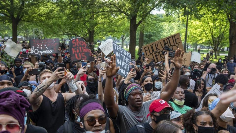 Demonstrators hold a protest in response to the police killing of George Floyd in Lafayette Square Park on May 29, 2020 in Washington, DC. (Warning: Image contains profanity) (Photo by Tasos Katopodis/Getty Images)