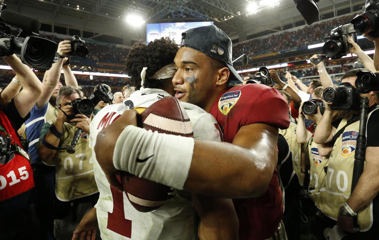 Alabama quarterback Tua Tagovailoa hugs Oklahoma quarterback Kyler Murray after the Orange Bowl.