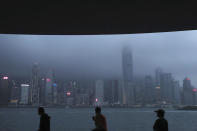 People sit on the waterfront of the Victoria Harbor of Hong Kong Thursday, May 28, 2020. Hong Kong has been living on borrowed time ever since the British made it a colony nearly 180 years ago, and all the more so after Beijing took control in 1997, granting it autonomous status. A national security law approved by China's legislature Thursday is a reminder that the city's special status is in the hands of Communist Party leaders who have spent decades building their own trade and financial centers to take Hong Kong's place. (AP Photo/Kin Cheung)