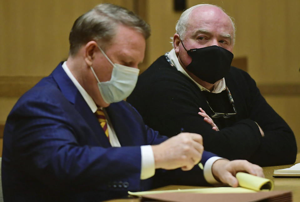 Michael Skakel, right, appears for his hearing at Stamford Superior Court, with his attorney Stephan Seeger, Friday, Oct. 30, 2020, in Stamford, Conn. A Connecticut prosecutor says Kennedy cousin Michael Skakel will not face a second trial in the 1975 murder of teenager Martha Moxley in Greenwich. (Erik Trautmann/Hearst Connecticut Media via AP, Pool)