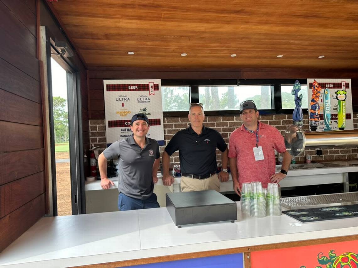 Firefighters from Hilton Head Island Fire Rescue manned the beer trailer Wednesday morning outside the town government’s RBC Heritage concession stand, which raises funds for the Hilton Head Firefighters’ Association nonprofit. Kyle Ramsey, left, says their location near the course entrance helps drive major foot traffic to the tent.