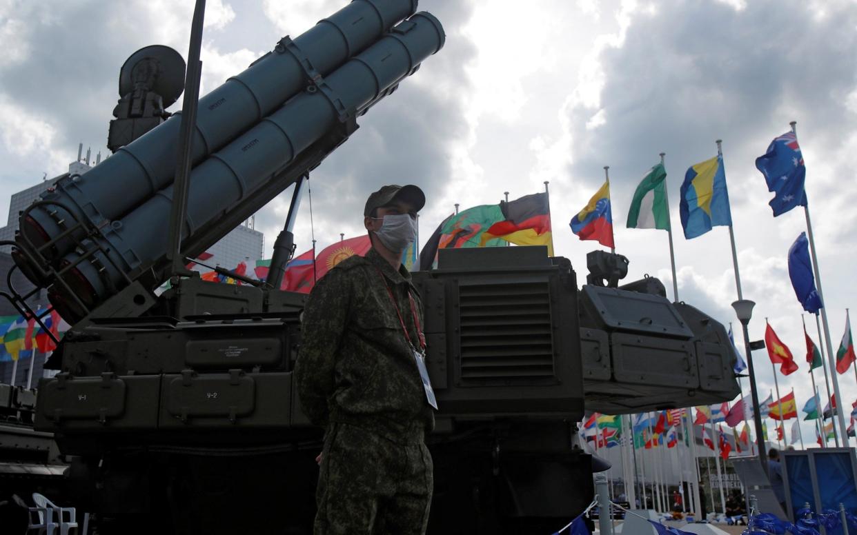 A serviceman stands next to a Russian Viking surface-to-air missile system on display during the International military-technical forum "Army-2020" in Moscow - Reuters