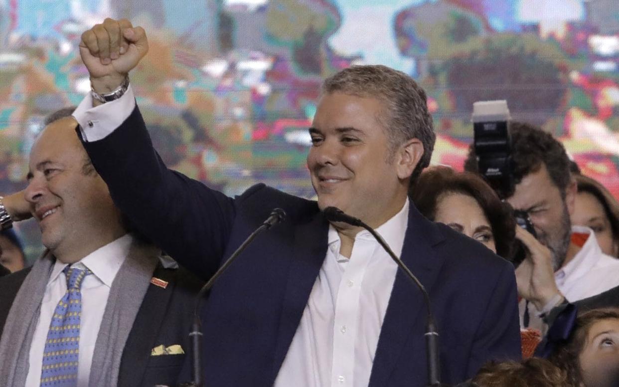 Newly elected Colombian president Ivan Duque celebrates with supporters in Bogota - AFP