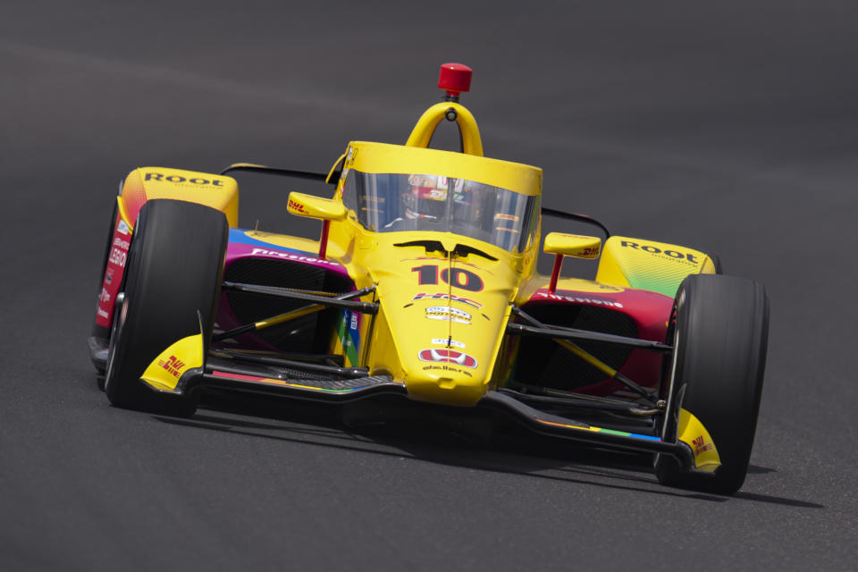 Alex Palou, of Spain, drives through the first turn during qualifications for the Indianapolis 500 auto race at Indianapolis Motor Speedway in Indianapolis, Saturday, May 18, 2024. (AP Photo/Michael Conroy)