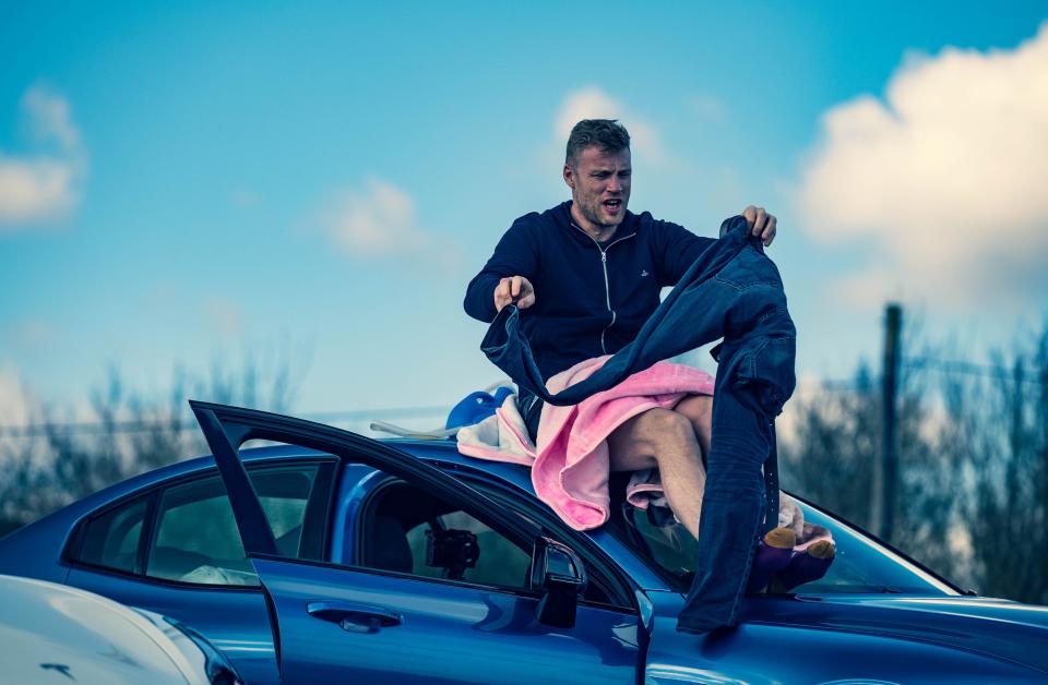 Freddie Flintoff gets changed on the roof of a car in 'Top Gear'BBC Studios/Lee Brimble