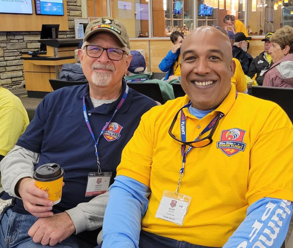 Vietnam veteran Harvey Sankey, left, talks with Henderson County Board of Education chairman Blair Craven on Oct. 1 prior to the Blue Ridge Honor Flight.