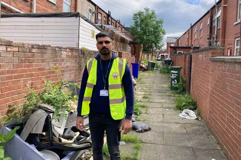 Councillor Kaleel Khan showing us issues of fly tipping in his ward of St Peters, Ashton