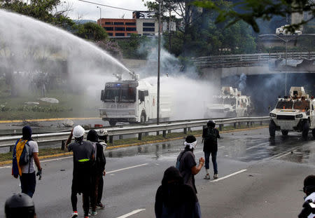 Demonstrators clash with police during rally against Venezuela's President Nicolas Maduro in Caracas, Venezuela May 1, 2017. REUTERS/Carlos Garcia Rawlins