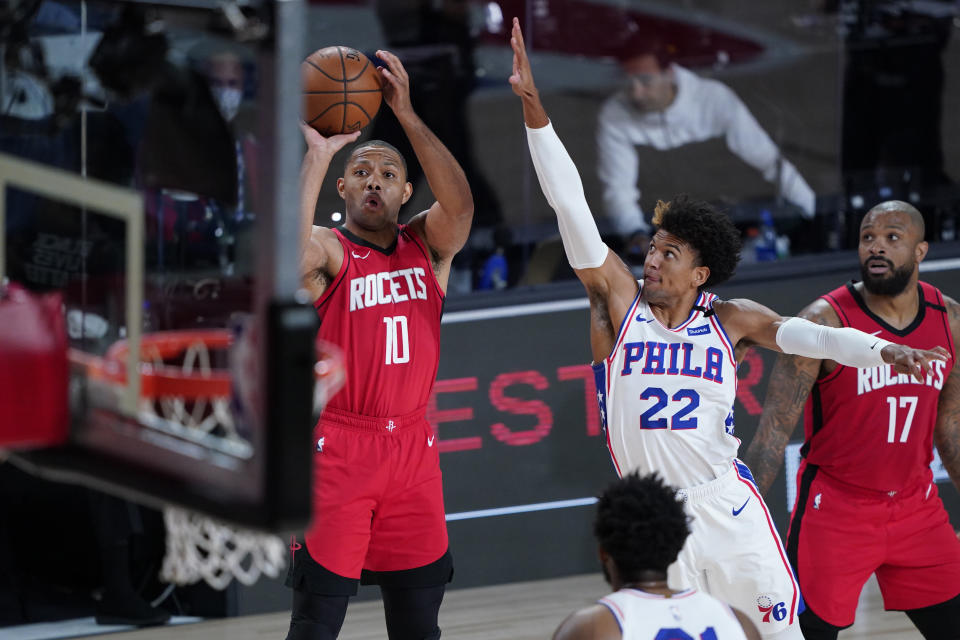 Houston Rockets' Eric Gordon (10) shoots over Philadelphia 76ers' Matisse Thybulle (22) during the first half of an NBA basketball game Friday, Aug. 14, 2020, in Lake Buena Vista, Fla. (AP Photo/Ashley Landis, Pool)