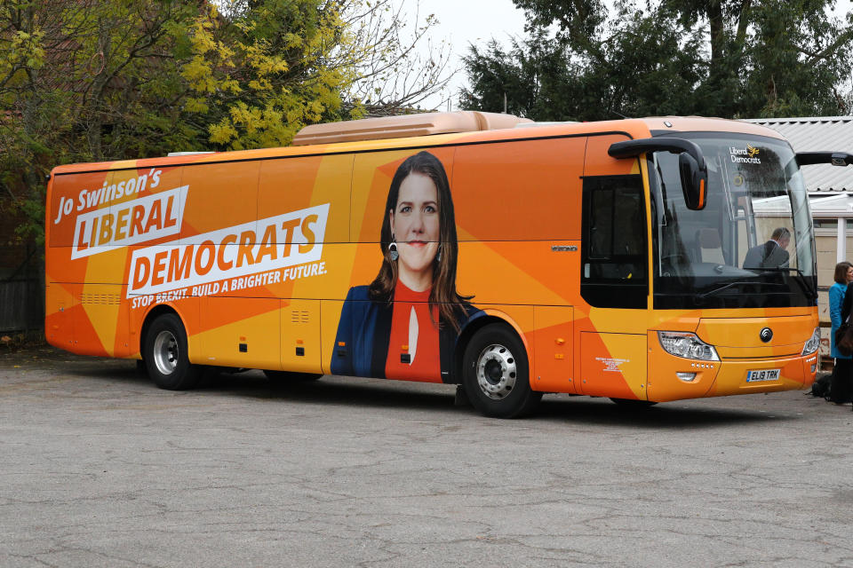 The Liberal Democrat electric battle bus in Esher during a visit by party leader, Jo Swinson, to Hinchley Wood school in Surrey.