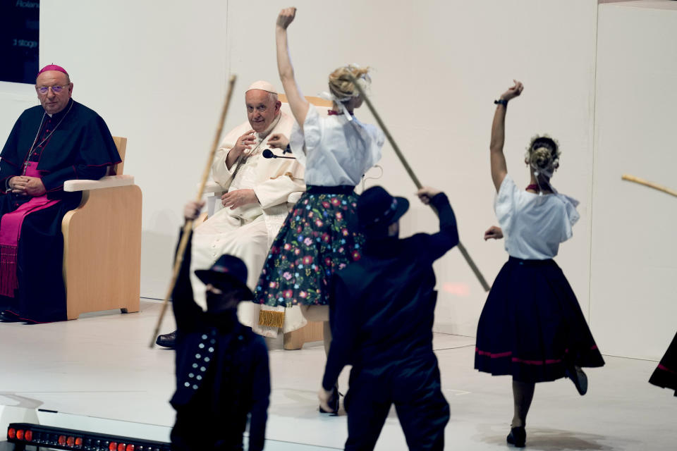 Pope Francis look at dancers during a meeting with young people at the Laszlo Papp Budapest Sports Arena, in Budapest, Hungary, Saturday, April 29, 2023. (AP Photo/Darko Vojinovic)