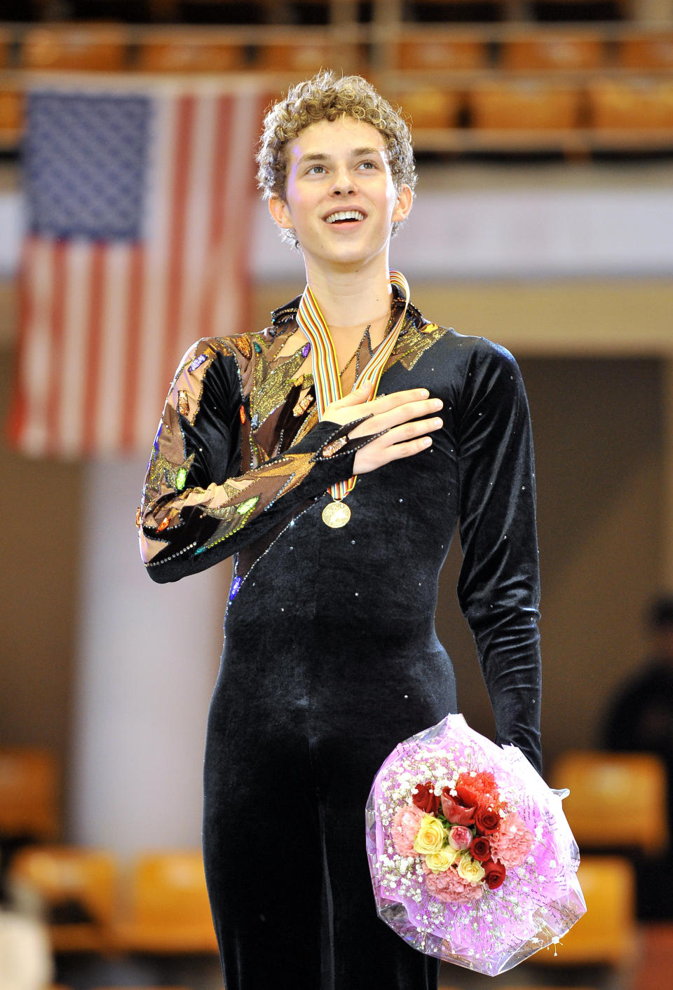 <p>Adam Rippon of the US sings his national anthem during the victory ceremony after the men’s free skating event during the ISU Four Continents Figure Skating Championships.<br>(Photo by Jung Yeon-JE/AFP/Getty Images) </p>