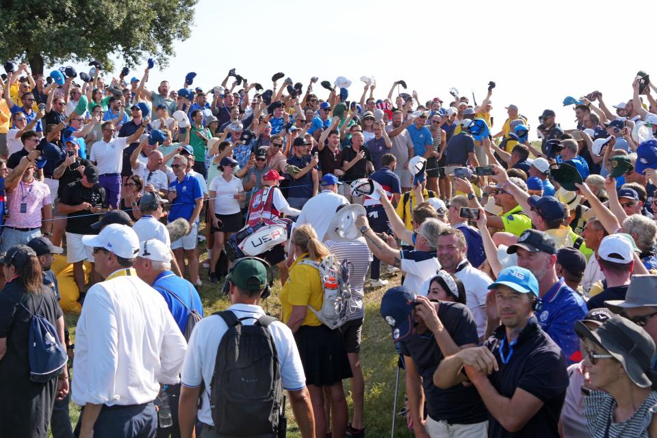 Oct 1, 2023; Rome, ITA; Fans wave their caps at Team USA golfer Patrick Cantlay during the final day of the 44th Ryder Cup golf competition at Marco Simone Golf and Country Club. Mandatory Credit: Kyle Terada-USA TODAY Sports