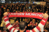 Fans of Bayern Muenchen celebrate the victory of their team in the UEFA Champions League.