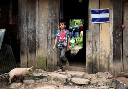 A child stands at the door of his house in Nicaragua's President Daniel Ortega's childhood town of La Libertad, Nicaragua October 22, 2016. Picture taken October 22, 2016. REUTERS/Oswaldo Rivas