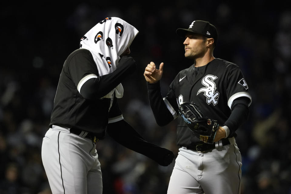 Chicago White Sox's Jose Abreu, left, and AJ Pollock celebrate the team's 4-3 win over the Chicago Cubs in a baseball game Wednesday, May 4, 2022, in Chicago. (AP Photo/Charles Rex Arbogast)