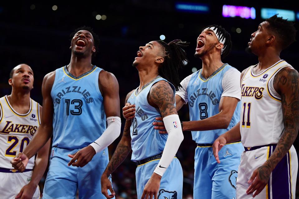 Memphis' Jaren Jackson Jr. (13),  Ja Morant (12) and Ziaire Williams (8)