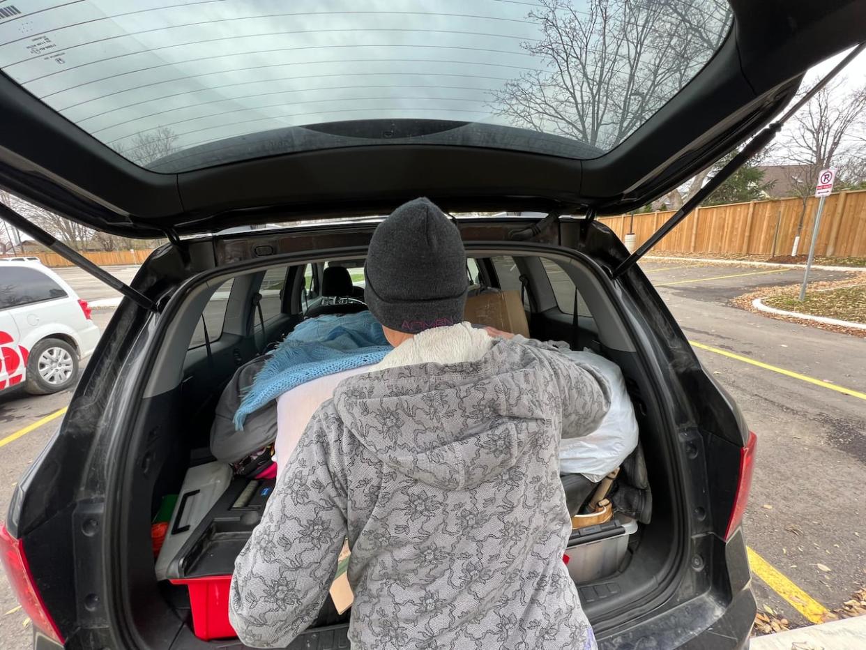 While this woman has a decent job, she's been unable to find a place to live after a flood left her without an apartment. She says that's in part due to her credit score because during lean times, she prioritized paying the rent over paying credit card bills. (Andrew Lupton/CBC  - image credit)