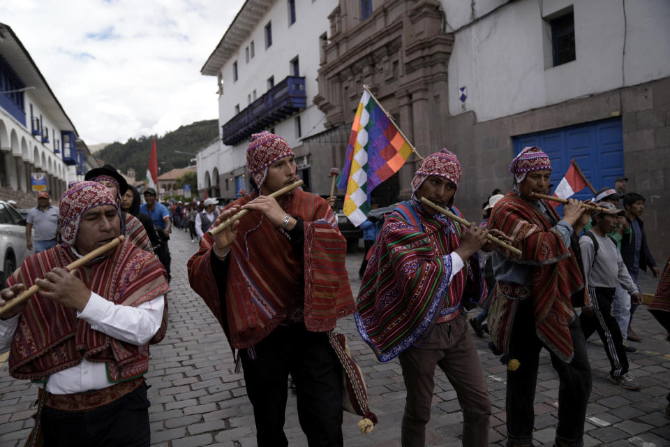 Musicians play traditional Peruvian flutes known as quenas, during an anti-government march in Cusco, Peru, Thursday, Feb. 2, 2023. Protesters are seeking immediate elections, the resignation of President Dina Boluarte and the dissolution of Congress, since former President Pedro Castillo was ousted and arrested for trying to dissolve Congress in December. (AP Photo/Rodrigo Abd)