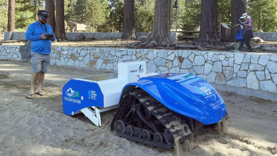 JB Harris controls the BeBot trash-collecting robot Wednesday, July 5, 2023, in Kings Beach, Calif. Harris and his partner, JT Chevallier, brought the Eco-Clean Solutions machine to the Tahoe Basin for cleanup after July 4.