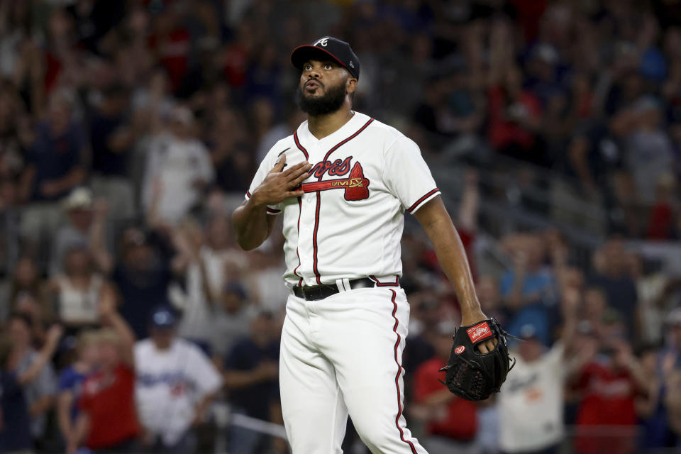 Atlanta Braves relief pitcher Kenley Jansen reacts after the team's 5-3 win over the Los Angeles Dodgers during a baseball game Saturday, June 25, 2022, in Atlanta. (Jason Getz/Atlanta Journal-Constitution via AP)